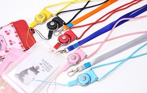Detailed view of colorful retractable ID badge lanyards with swivel metal hooks and card holders