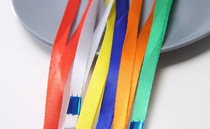 Close-up of multi-color nylon lanyards with reinforced blue ends for card holders