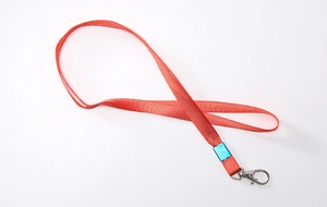 Flat weave red fabric lanyard with a metal swivel lobster clasp for ID card badges