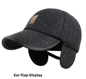 Detailed view of winter baseball cap earflaps with leather trim and wool fabric