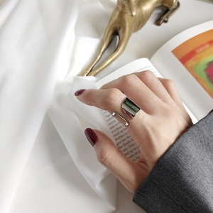 Minimalist wide geometric S925 silver open ring styled with modern luxury accessories