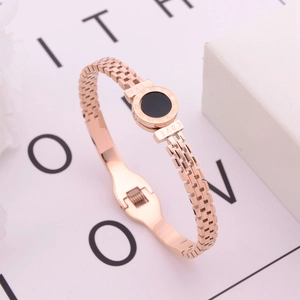 Rose gold hollow Roman numeral bangle with black round shell and LOVE engraving