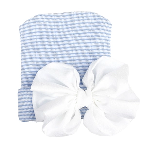 Detailed view of striped baby knit hat with a large white chiffon bow accessory