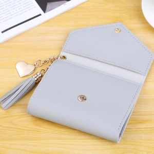 Short light gray leather wallet for women with heart pendant and tassel decoration