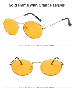 Detail view of oval retro sunglasses with gold metal frames and orange lenses