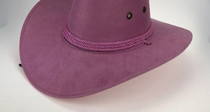Detail view of purple suede cowboy hat showing fine stitching and metal ventilation eyelets