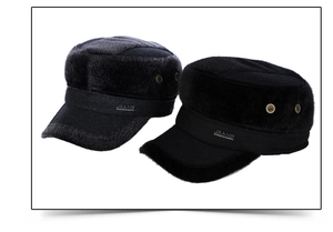 Detail of wool fabric texture and metal jeans logo on flat top winter caps
