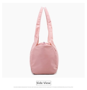 Side view of foldable pink waterproof yoga travel bag with durable nylon handles