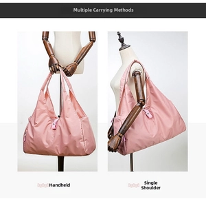 Pink large capacity foldable nylon tote bag showing handheld and shoulder carrying modes