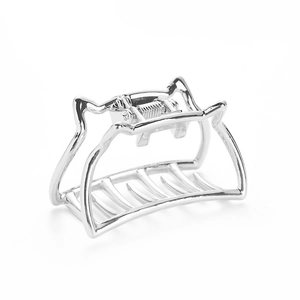 Minimalist silver geometric hollow metal hair claw clip shown on a white background