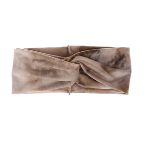 Macro detail of bohemian tie-dye twisted headband in brown marble knit pattern