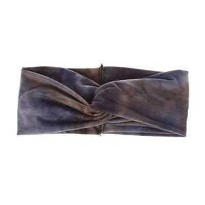Detail of bohemian tie-dye knot headband in purple and brown elastic knit fabric