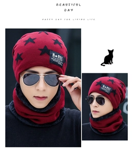 Detail view of red winter knitted hat and neck gaiter set with thick fleece lining and star pattern