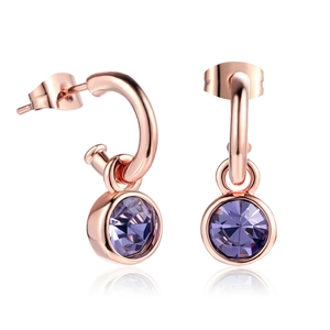 Close-up of rose gold earrings featuring brilliant round-cut purple zircon crystals