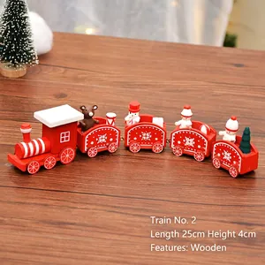 Red 25cm wooden Christmas train set decoration with cartoon characters on a wooden table