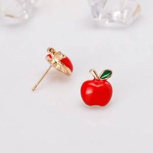 Glossy red apple stud earrings with green leaf and golden finish on white background