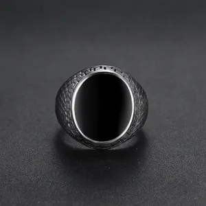 Vintage stainless steel ring for men with textured band and black oval meander design
