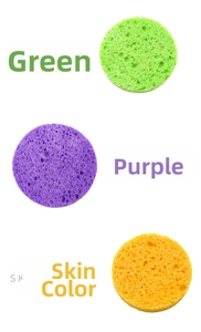 Macro shot of circular cellulose facial sponges in green, purple, and nude skin tones
