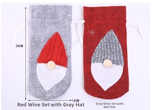 Detail of Christmas gnome wine bottle covers with knitted hats and white drawstring closure