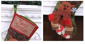 Detail of burlap Christmas stocking with Merry Christmas embroidery and 3D reindeer doll