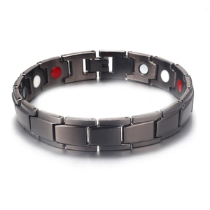 Detail of black gold-plated bracelet showing links with red and white healing magnets