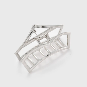 Detailed view of large silver geometric hollow metal hair claw clip with spring structure