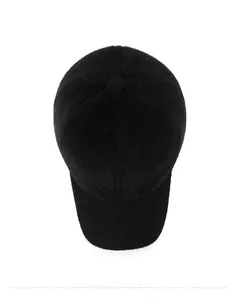 Detailed top view of a black plush winter baseball cap with soft faux fur texture