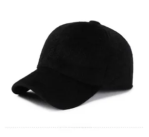 Detail of black faux fur winter baseball cap showing soft texture and Sport logo