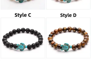 Detail of lava stone and tiger eye bead bracelets with turquoise turtle charms