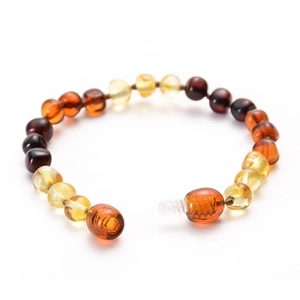 Handcrafted Baltic amber baby bracelet with colorful beads and secure screw clasp