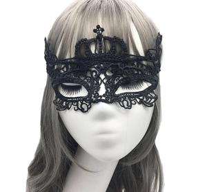 Detailed view of a black lace masquerade mask with an elegant crown design on white