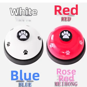 Detail view of colorful metal pet training bells with cute paw print button design