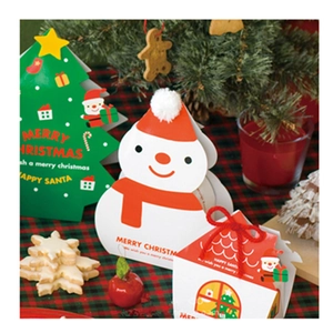 Christmas gift boxes featuring snowman, tree, and cabin shapes with festive accessories