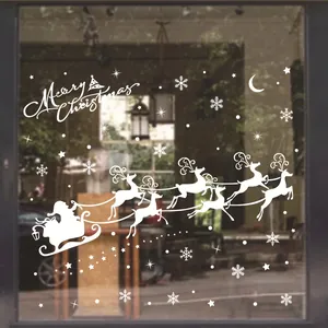 Stickers de Noël blancs pour vitrine avec Père Noël, rennes et flocons sur verre