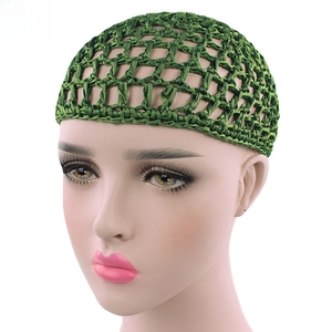 Detail of dark green handmade crochet hairnet with wide mesh and elastic nylon texture