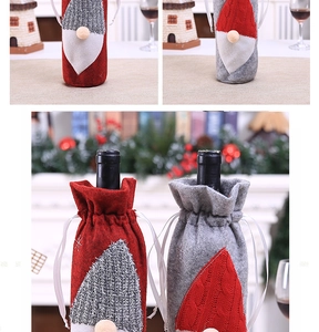 Detail of red and grey gnome wine bottle covers made from knit and felt Christmas fabric