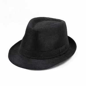 Detailed view of the woven texture and black ribbon band on a summer linen fedora hat