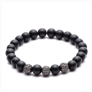 Detail of 8mm matte black stone beads with micro-pave silver zircon spheres on bracelet