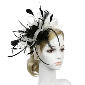 Detail of elegant black and white feather fascinator hat with mesh and delicate beadwork