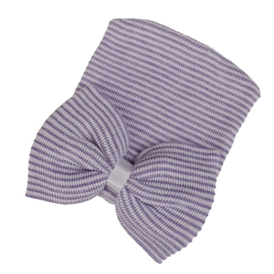 Detailed view of purple striped knit baby hat with a large decorative soft bow