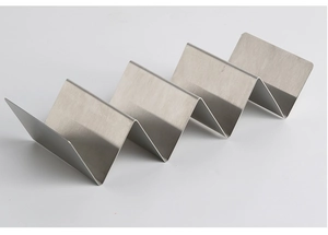 Close-up of a four-slot stainless steel taco holder with a brushed metal surface finish