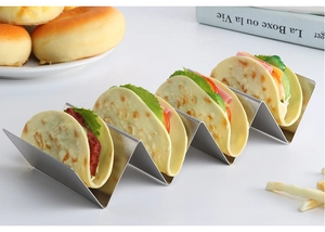 Detail of wavy stainless steel taco holder rack with four slots on a clean background