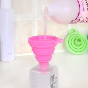 Pink collapsible silicone funnel for liquid dispensing into a 400ml bottle