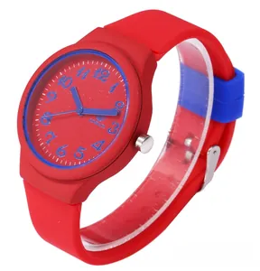 Close-up of red and blue silicone sports watch dial with clear Arabic numerals