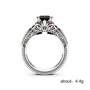 Retro eight-claw ring with square black gemstone and intricate hollow floral details