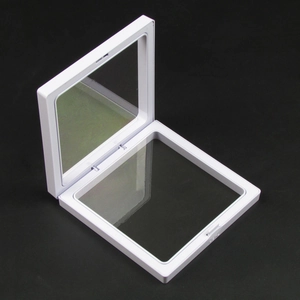 Detailed macro view of an open white square PE film floating jewelry display case