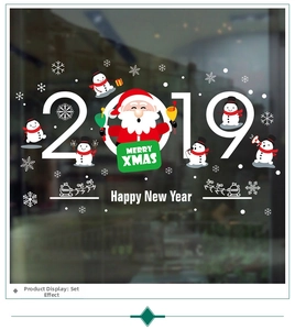 Detail of Christmas window clings featuring Santa, snowman, and snowflakes decorations