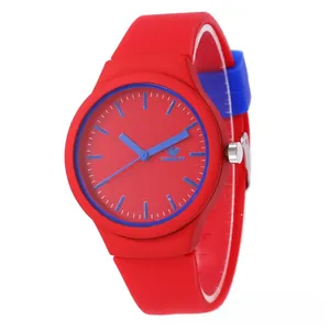 Detail view of red silicone watch featuring blue markers and adjustable strap design