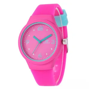 Close-up of pink and light blue silicone watch with rhinestone scales and numerals