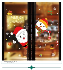 Close-up of Santa Claus and snowman static window decals with Merry Christmas text